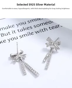 Detailed macro view of S925 sterling silver bow earrings with elegant long tassels