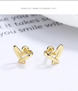 Macro shot of 925 silver hollow heart stud earrings with secure screw ball back fasteners