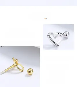 Macro view of S925 sterling silver hollow heart studs with screw back and hallmark