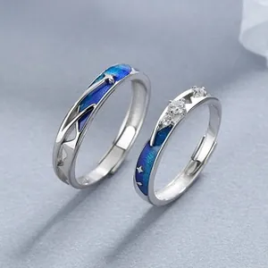 Detail of adjustable S925 silver couple rings with blue starry sky enamel and small diamonds