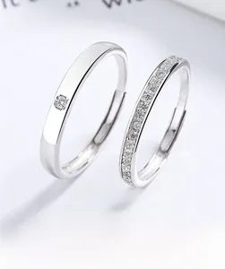 Detail of adjustable S925 silver couple rings featuring single diamond and pavé settings