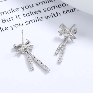 Elegant 925 silver bow earrings featuring sparkling cubic zirconia and long dangling bars