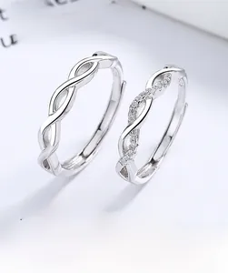 Detailed macro view of S925 sterling silver intertwined couple rings with zircon stones