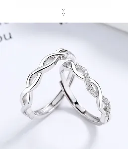 Macro detail of 925 sterling silver couple rings with twisted design and cubic zirconia