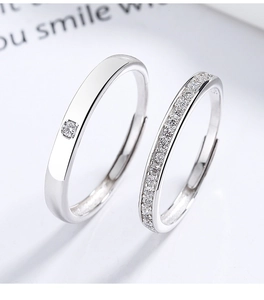 Macro shot of 925 silver adjustable couple rings featuring minimalist band with cubic zirconia