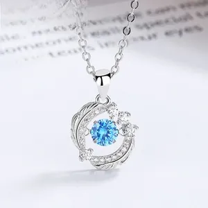 Close-up of S925 silver necklace with floating blue gemstone and zircon halo