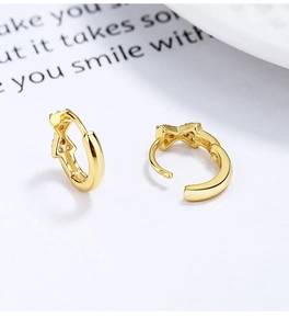 Macro shot of 925 sterling silver S925 hallmark on gold plated bow knot earrings