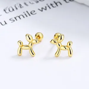 Detailed view of golden balloon dog stud earrings with secure ball screw-back closure