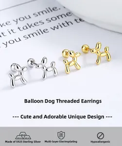 Macro shot of 925 sterling silver balloon dog stud earrings in gold and silver plating