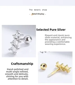 Vue macro détaillée de boucles d'oreilles en argent 925 avec trois pierres de zircon