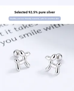 Close-up of 925 sterling silver balloon dog stud earrings with a polished mirror finish