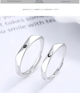 Detail of 925 sterling silver sun and moon rings with geometric faceted surface