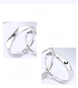 Detailed macro view of 925 sterling silver sun and moon adjustable rings for couples