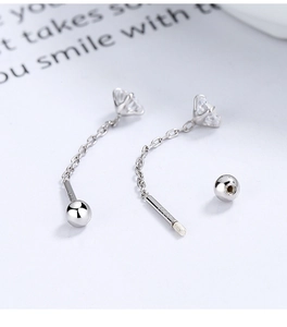 Detailed view of S925 sterling silver stamp on clover earrings with zircon and tassels