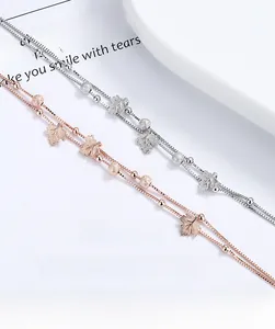 Detail of 925 silver maple leaf bracelets in rose gold and silver on poetic paper