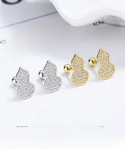 Macro detail of 925 silver gourd stud earrings with CZ inlay and screw back closure
