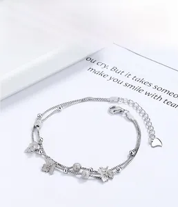 Detail of 925 sterling silver maple leaf bracelet with frosted beads and heart charm