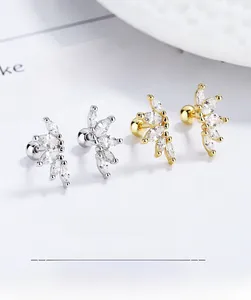 Detail of marquise-cut zircon stud earrings in silver and gold with secure screw-back closure