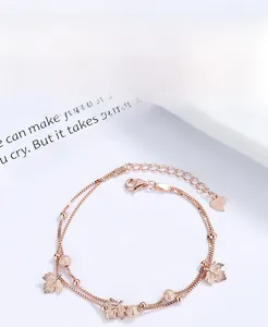Macro detail of S925 sterling silver maple leaf bracelet charms in rose gold finish