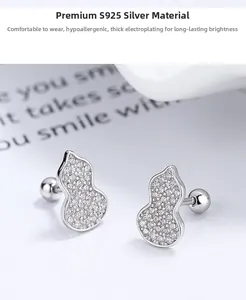 Macro detail of S925 sterling silver gourd stud earrings with micro-set white zircon stones
