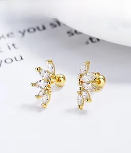 Macro detail of S925 sterling silver marquise zircon screw back stud earrings in gold