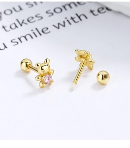 Macro shot of 925 silver bear earring with pink zircon and threaded screw back ball
