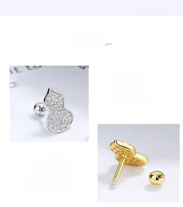 Detailed macro view of 925 silver gourd stud earrings with white zircon pavé setting