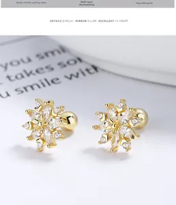 Macro detail of 925 sterling silver snowflake earrings with marquise-cut zircon stones