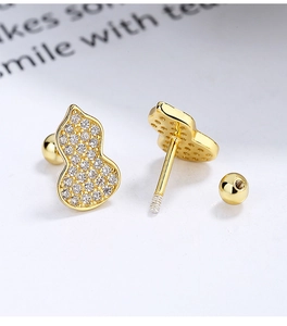 Macro view of gold plated 925 silver gourd stud earrings with screw ball backs