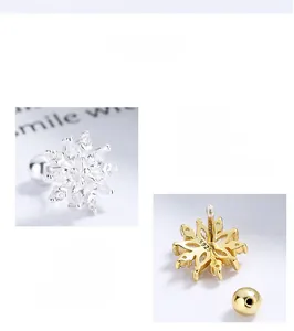 Detailed close-up of S925 sterling silver stamp and screw back on snowflake earrings
