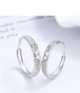 Detail of adjustable 925 silver couple rings featuring matte finish and reindeer horn design