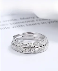 Close-up of S925 sterling silver couple rings with stag antler design and frosted texture