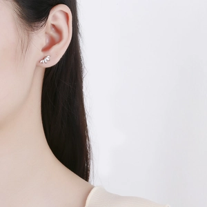 925 sterling silver marquise zircon stud earrings worn by a model in a close-up profile view