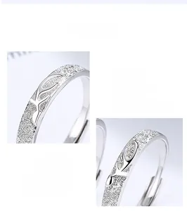 Macro detail of 925 sterling silver couple ring with matte texture and deer horn design