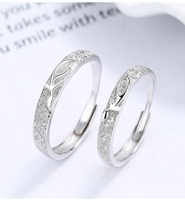 Macro detail of adjustable 925 silver couple rings with textured matte deer antler design