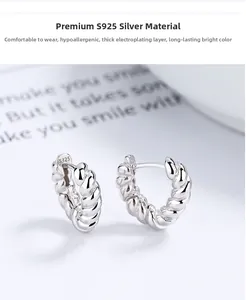Macro shot of S925 sterling silver hoop earrings with twisted texture and hallmark