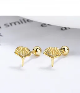 Macro view of 925 sterling silver ginkgo leaf studs with 18K gold plated texture