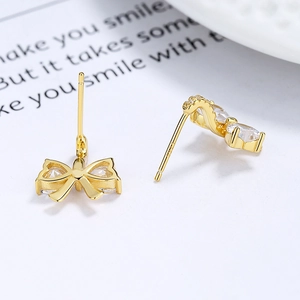 Boucles d'oreilles nœud papillon en argent S925 avec zircons scintillants dorés