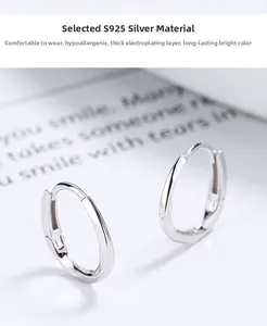 Detailed macro view of S925 sterling silver Mobius earrings with polished finish