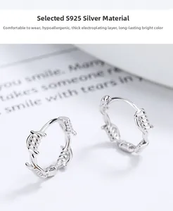 Close-up of 925 silver twist rope earrings with thick plating and creative wire design