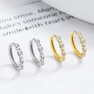 Detailed macro view of S925 sterling silver hoop earrings with micro-pave zircon crystals