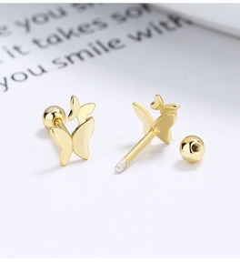 Detailed close-up of golden 925 silver butterfly earrings with screw-back ball closure