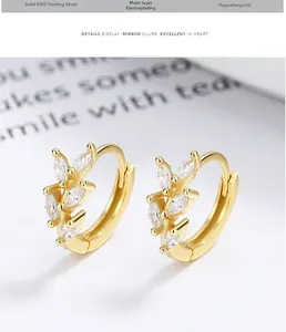 Detail of 925 sterling silver leaf earrings with marquise-cut marquise stones in gold finish
