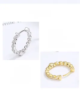 Macro view of S925 sterling silver twisted hoop earrings with micro-set zircons