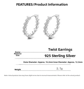 Detailed view of 925 sterling silver twisted hoop earrings with pave cubic zirconia
