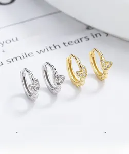Close-up of S925 sterling silver heart earrings with sparkling cubic zirconia pavé