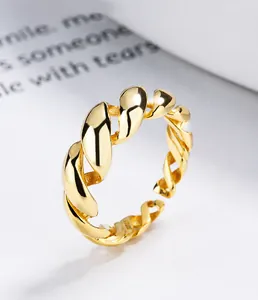 Macro view of S925 sterling silver twisted rope ring with elegant golden finish