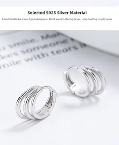 Detailed macro view of triple hoop earrings crafted in polished 925 sterling silver