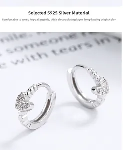 Detail of S925 sterling silver heart earrings with pave setting and thick electroplating