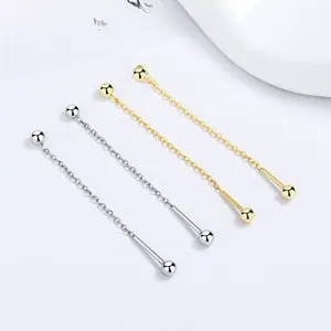 Detail of 925 sterling silver long tassel chain earrings in gold and silver finishes